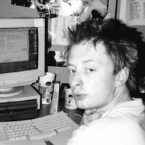 Meme of Thom Yorke in front of an old computer